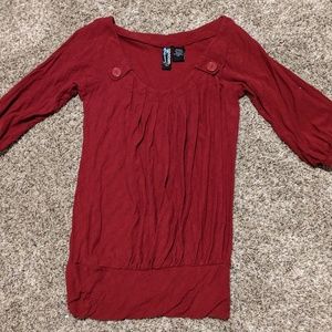 Red pleated knit top with button detail